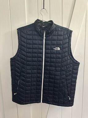 The North Face Men's Navy Black Quilted Vest with White Zip Trim